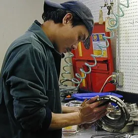 A man working on something in his shop.